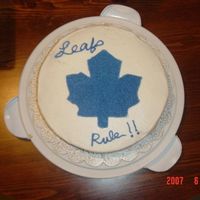 Toronto Maple Leafs Cake made for my son's 12 Birthday. The words were not turning out right during the transfer, so I gave up, and piped in blue stars