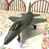 Air Force F-16 Fighter Jet F-16 Jet with working after burner, Flashing red lights underside and top of tail, a single clear landing light is shining on the top of...