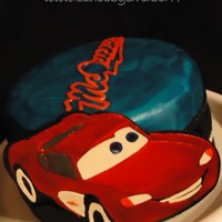 Lightning Mcqueen I made this cake for a client's nephew. Lightning McQueen and the McQueen logo are hand-carved out of gumpaste. The cake is...