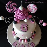 Alexa's Sweet Shoppe This is a french vanilla cake with my standard buttercream. Covered in fondant, and gumpaste designs. Super fun cake to make, and an even...