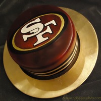 49Ers This is a cake that I made for my husband's birthday. He is a big 49ers fan (obviously). The logo is hand carved out of gumpaste, and...