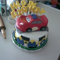 Lightening Mcqueen Cake (4Th Cake) This was my fourth cake. The car is made from cake and I carved it to look like lightening Mcqueen. The letters are gumpaste. I didnt have...