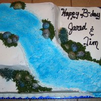 River Cake River cake...river sprayed with airbrush and blue sugar crystals added, rocks made out of malted milballs which were cut in half and...
