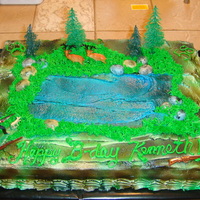 Camoflage Hunting Theme Cake Buttercream airbrushed for camo appearance, rocks (malted milk balls cut in half) airbrushed - grass buttercream...hunting items was a kit...