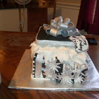 Black And Silver Birthday Cake 4 8" square stack cakes top half was vanilla butternut flavored with chocolate buttercream and the bottom 2 layers was coconut cake...