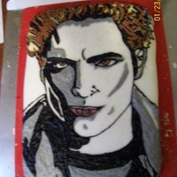 Edward Cullen Twilight Movie Poster Edward Cullen's face in buttercream icing on a fondant covered 8x11 cake for a birthday cake. He also has cake sparkles where his face...