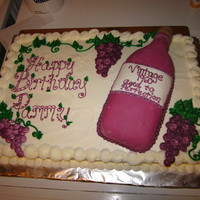 Wine Bottle Cake fondant covered wine bottle, buttercream icing. the powdered sugar made the bottle look old. :)