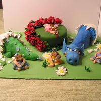 Fairy Garden Dragons My daughters and I created this cake. The round and eggs are cake. The dragons are rice treats and fondant. Everything else is fondant....