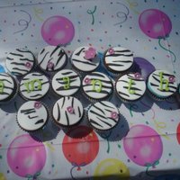 Zebra Cupcakes Zebra cupcakes for my nieces 13th birthday. My 6 year old helped me with the stripes on a few of them, can you tell which ones? :)