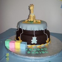 Animal Shapes I made this cake to look like the invitations. Covered in chocolate fondant, with fondant accents, and the giraffe is made from fondant...