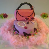 Fashionista Cake red velvet cake, with cream cheese frosting. Marshmallow fondant the colors are americolor electric