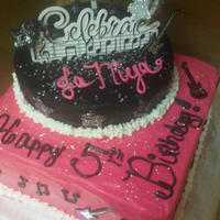 "rock Star" Cake Little girl wanted a hot pink, black and white cake in rock star theme. All buttercream except stars made of fondant and edible glitter.