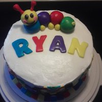 Ryan's 1St Birthday Chocolate cake torted and filled with bavarian cream, buttercream frosting, and MMF accents and caterpillar. Inspired by many cakes online...