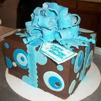 Present Cake Dark chocolate mint cake, 3 layers of mint chocolate chip filling, chocolate buttercream, and MMF bow and dots. Trying to practice my...