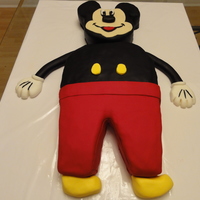Mickey Mouse Mickey mouse cake made for a very special 1 year old. The head is red velvet cake with chocolate raspberry ganache filling. The body was...