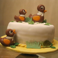Ducks Cake cake covered with fondant, chocolate and gumpaste accents