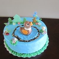 Duck In Da Pond 9" vanilla cake filled and iced with vanilla BC chocolate and fondant accents