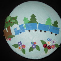 Train Cake yellow cake filled and covered with vanilla BC, fondant accents