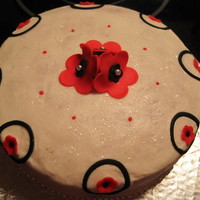 Black&red sponge cake covered with vanilla BC, fondant accent