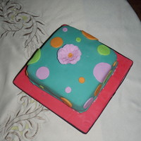 Polka Dots A fun cake with polka dots and a simple flower