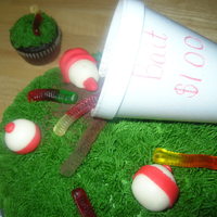 Bait Cake My first Birthday cake and cupcakes for my sons fishing themed party. Bobbers made of fondant, gummy worms and cup is only thing not edible...