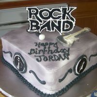 Rock Band They wanted the "Rock Band" video game theme. Buttercream frosting. Rock Band logo out of fondant. Along with the logos on the...