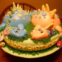 Twin Dragons :) This is a cake for a couple of darling little twin boys. Their family loves soccer- that's why there's a ball in one of the tails...