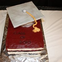 Graduation Stack of books with a graduation cap and tassel all made out of fondant.