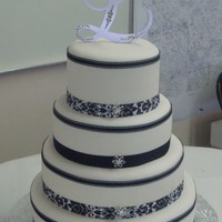 Tina And Turner's Wedding Cake This is my second fondant wedding cake. It is Satin Ice 6'', 8'', 10'' and 12''. The bride and...