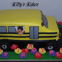 School Bus School bus with the bday girl hanging out the window with her cheerleading outfit on and a helmet...she's a "special" girl...