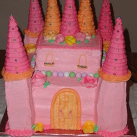 Pink Castle Cake Lemon & Strawberry cake layers with fresh raspberry filling. All buttercream icing, towers made of rice crispy treats & turrets are...