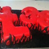"lil 38" Flame Cake The cake is shaped to say "LiL 38, with the L's overlapping to form an i. Covered in red fondant with fondant flames. Disco dust...
