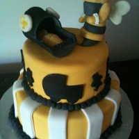 Georgia Tech Baby Shower Cake Cake is covered in fondant. Ball border is royal icing. Buzz the bee and bassinet w/baby are gumpaste.