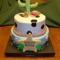 Western Cake For a family reunion. Butter cream icing, 50/50 sugar paste/MMF mixture for cactus, hat and star. MMF road. Piped butter cream for clouds,...