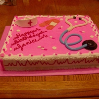 Nurse Cake 1/2 sheet cake, butter cream icing with MMF detail. Nurses' hat is out of sugar paste.