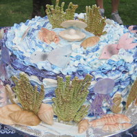 Ocean Underwater Cake For my 4th grade son's end of year party. Vanilla cake with whip cream and strawberries center, buttercream frosting. Shells, fish and...
