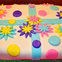 Flowered Birthday This cake was for a birthday for a coworker of my sister's. It was a surprise party at work and we volunteered to do the cake. It was...