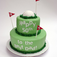 Golf Cake Golf ball and flags done in fondant. All letters cut with my Cricut Create.