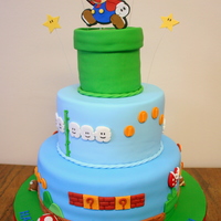 Super Mario Birthday Cake Made this for my hubby's 30th birthday. Everything on the cake is fondant and the Mario/Stars on top are gum paste. Thanks for looking...