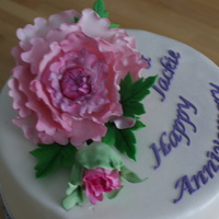 Anniversay Cake This cake is for my daughter and son-in-law's 3rd wedding anniversay. First time I've made a Peony and also first time I used my...