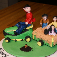 Husband's 65Th Birthday Never thought I'd see him on a John Deere, but he got a new lawn mower for his 65th birthday. Now he loves to mow 4 acres and pulls...