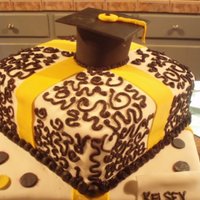 Happy Graduation Cake 2009 This cake is fondant with royal icing piping and fondant cap/ribbons/dots. My first real attempt at piping.