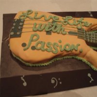 Guitar Grooms Cake This guitar cake was made to look like his actual bass guitar down to the color.Live life with passion is his favorite quote.