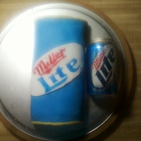 Miller Lite Can I made this cake from a loaf pan, rounded it out and then covered it in homemade MMF, used a 50/50 combo to make the label and painted logo...
