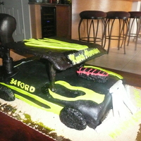 Dwarf Race Car Vanilla cake with strawberry buttercream filling. Wrapped in MMF and decorated with MMF. Top and sides are rice krispees wrapped in fondant...