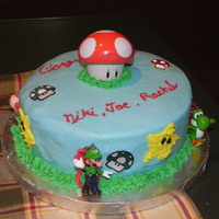 Mario Brothers Graduation Cake Made this for my son's friends...they love to play Mario Bros. at my house. Yellow cake with buttercream icing, stars are piped...