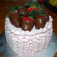 Ruffle Cake With Chocolate Covered Strawberries This is a small little 6 inch cake that I made for my birthday. It's WASC with vanilla buttercream. Used the 104 rose tip to do the...