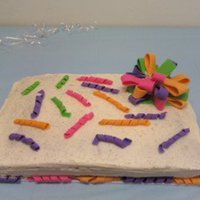 Birthday Present Cake I delivered this cake on Friday, and the bow fell on Saturday, but I think it got too hot.