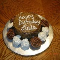 Linda's 41St Birthday German chocolate cake accompanied with buttercream and chocolate covered cup cakes