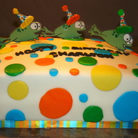 Froggy Birthday Fun! White Funfetti Cake with White Buttercream covered in White MMF and multi-colored fondant dots. Gumpaste frogs were from an image traced in...